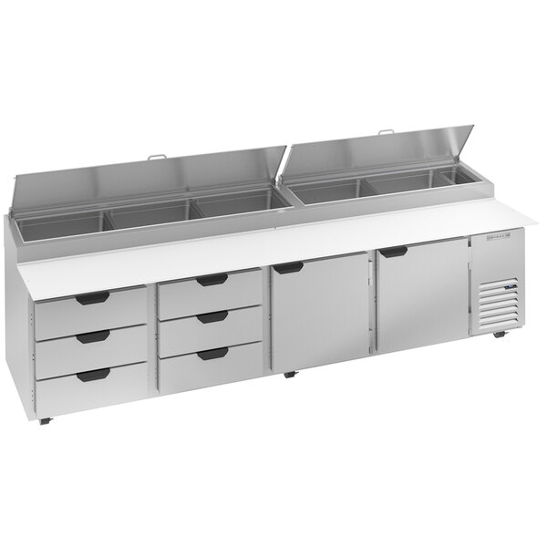A stainless steel Beverage-Air pizza prep table with six drawers on a counter.