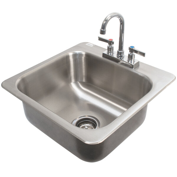 A stainless steel Advance Tabco drop-in sink with faucet.