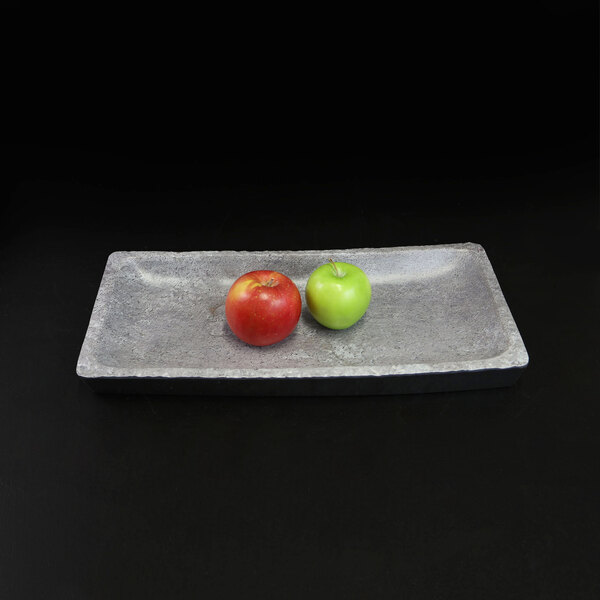 An Elite Global Solutions rectangular coal melamine serving platter with two apples on it.