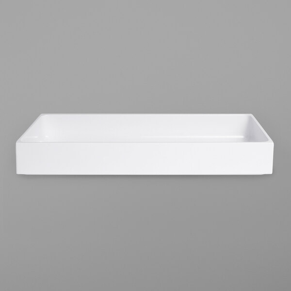 A white rectangular object on a gray background.