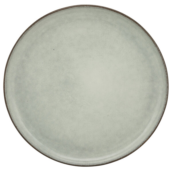 A white porcelain salad plate with a brown border.