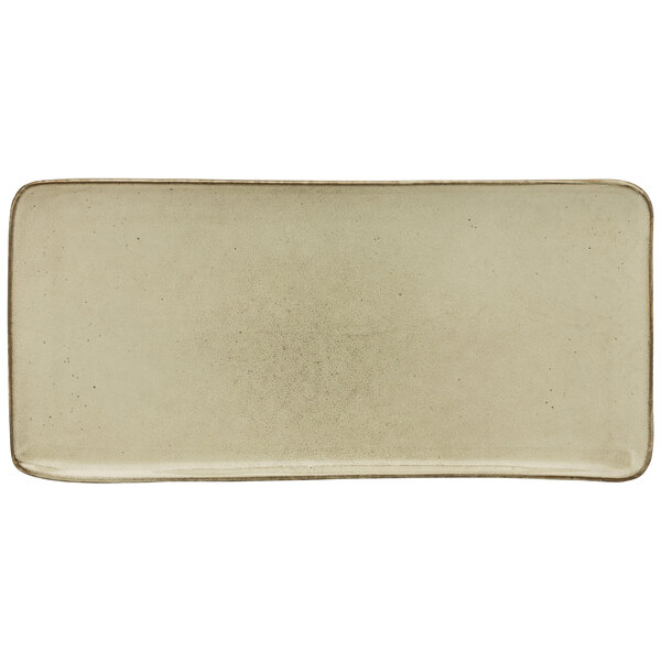 A white rectangular porcelain platter with a brown border.