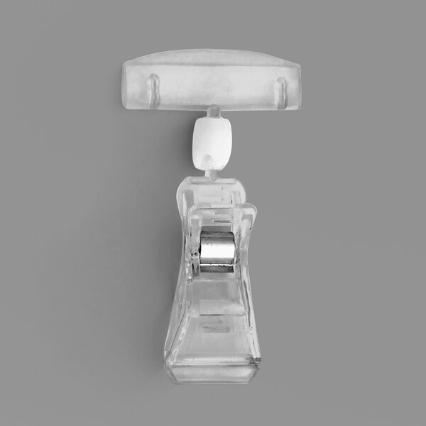 A clear plastic clip with a white border.