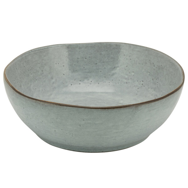 A blue porcelain bowl with a brown rim.
