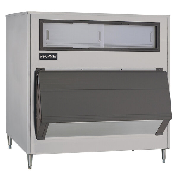 A large metal Ice-O-Matic upright storage bin with a metal frame and a door.