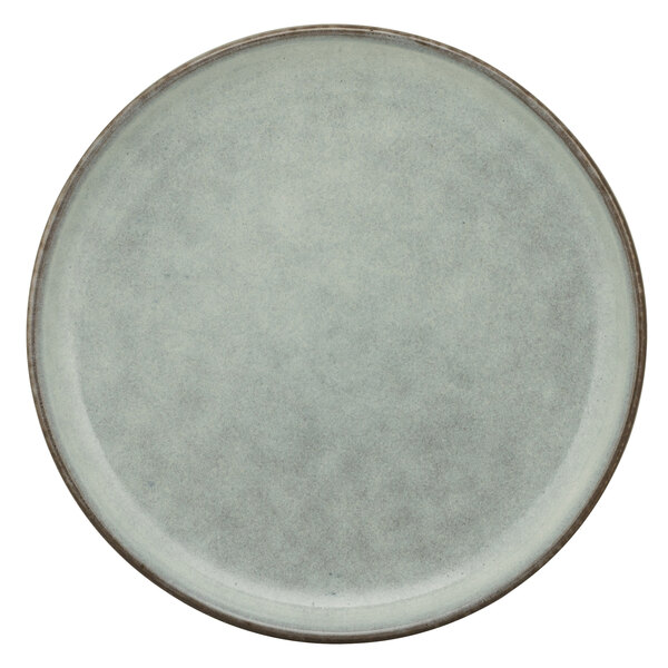 A close up of a 10 Strawberry Street Firenza blue porcelain bread and butter plate with a white background.