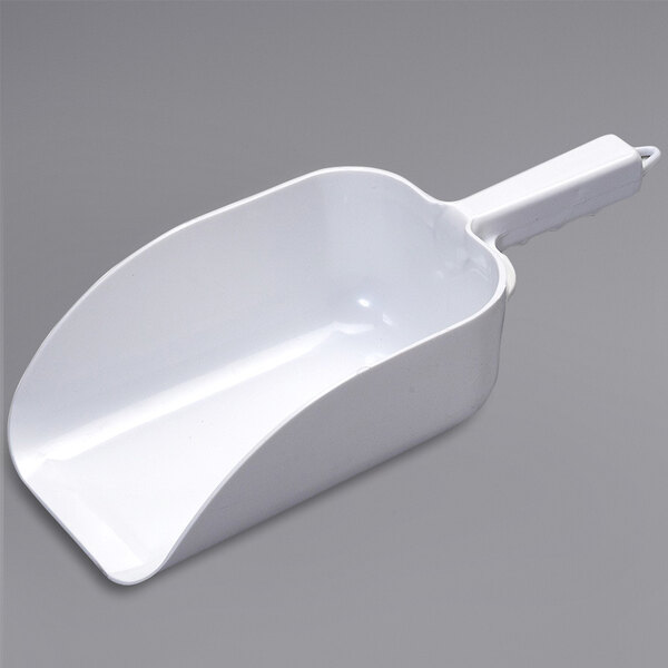 A white plastic Ice-O-Matic ice scoop with a handle.
