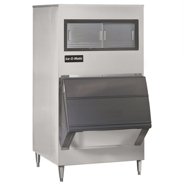 An Ice-O-Matic stainless steel upright ice storage bin with black legs.