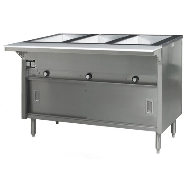 A stainless steel Eagle Group hot food table with three open wells and sliding doors.