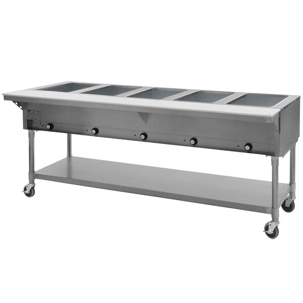An Eagle Group stainless steel open well hot food table on a counter.