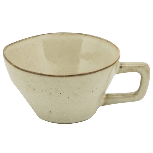 A beige porcelain cup with a handle.