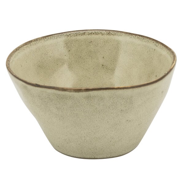 A 10 Strawberry Street beige porcelain bouillon bowl with a brown rim.