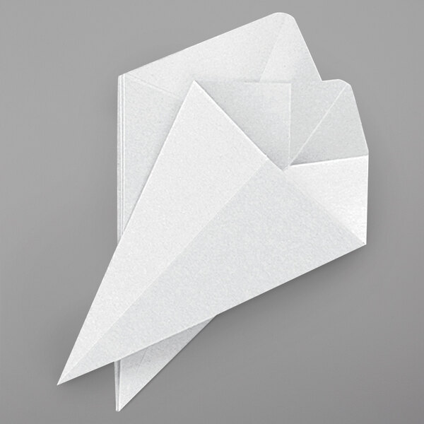 A white paper cone with a paper airplane on it.