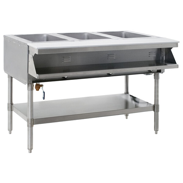 A stainless steel Eagle Group hot food table with three sealed wells on a counter.