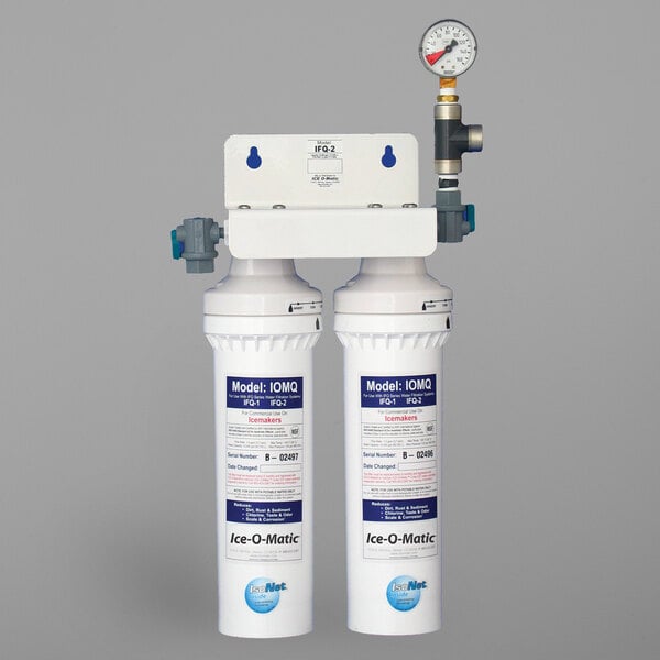 An Ice-O-Matic water filter system with two gauges.
