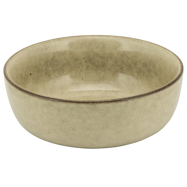 A beige porcelain bowl with a brown rim.
