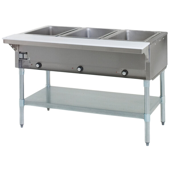 An Eagle Group hot food table with three open wells on a galvanized base.