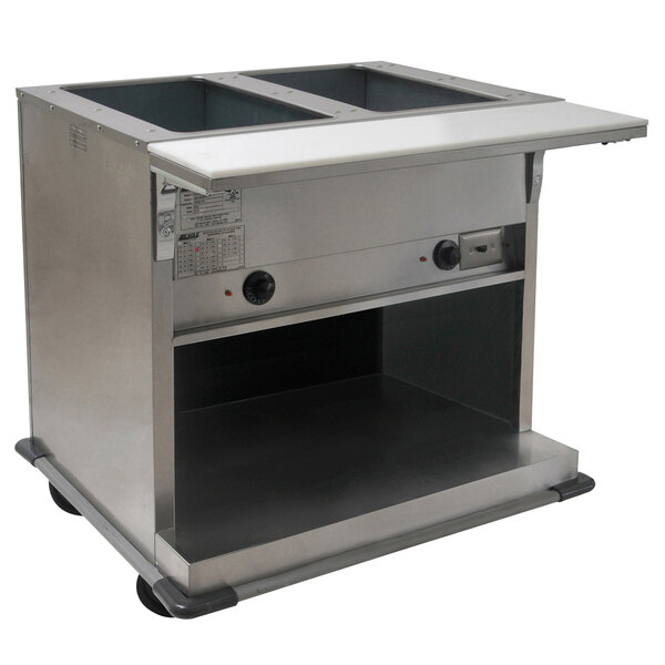 An Eagle Group stainless steel hot food table with open wells on a counter.