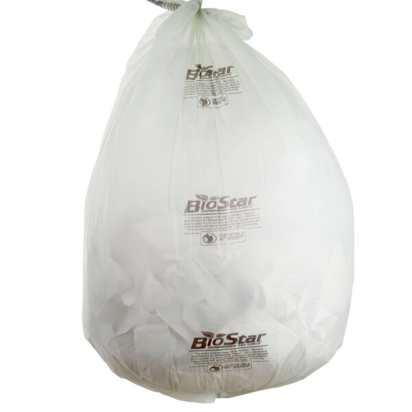 A white plastic bag with brown text that reads "BioStar 60 Gallon Compostable Trash Can Liner"