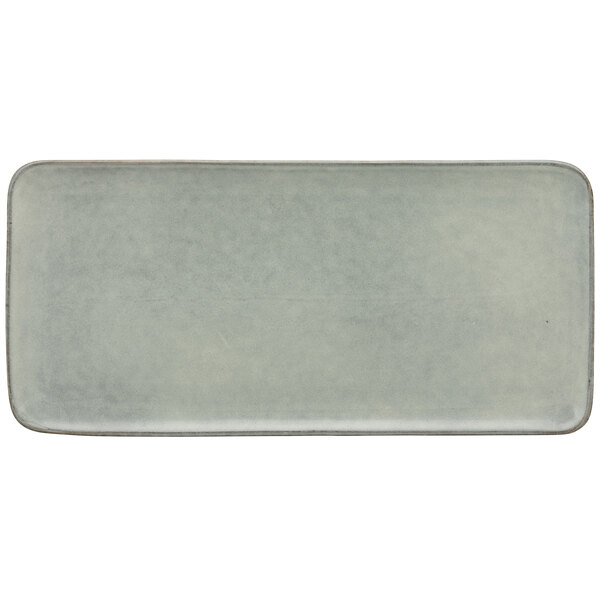 A blue rectangular porcelain platter with a white background.