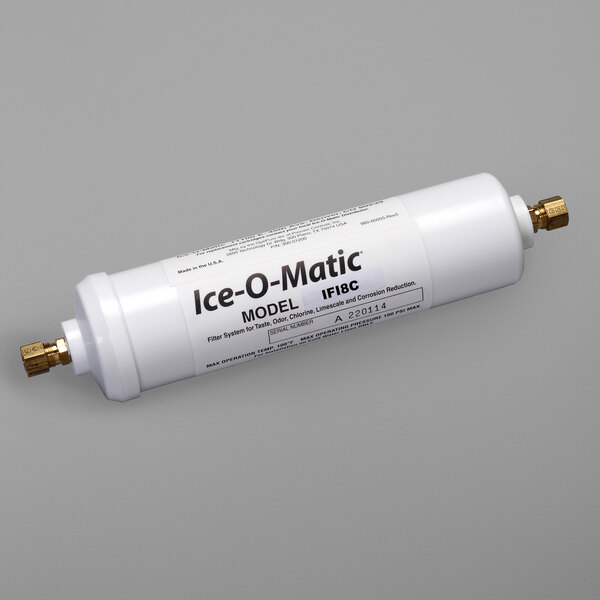 A white Ice-O-Matic water filter cartridge with black text on a label and a white tube with black text.