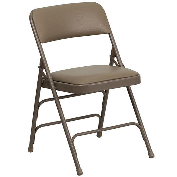 A beige metal folding chair with a padded tan seat.