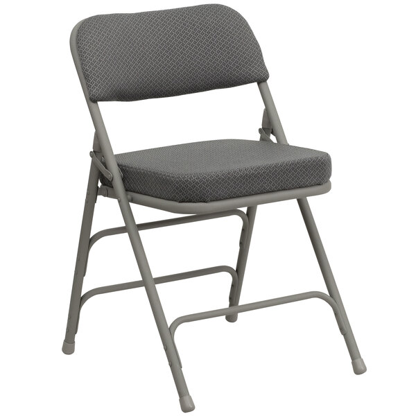 A gray metal folding chair with a padded fabric seat.