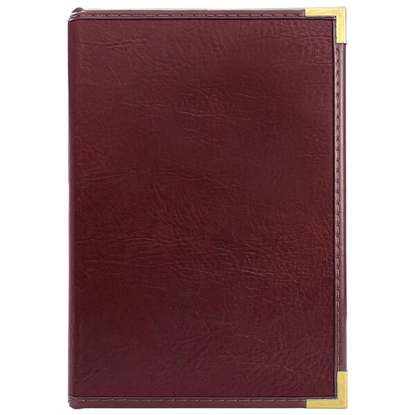 A red leather H. Risch Seville menu cover with gold corners.