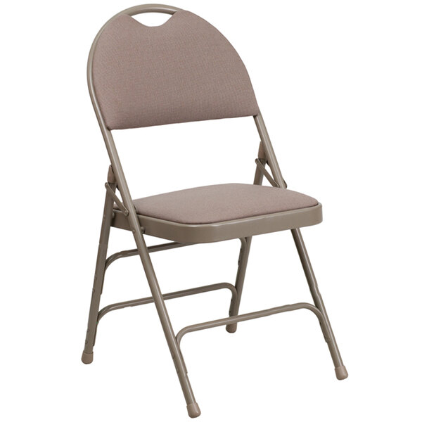 A Flash Furniture beige metal folding chair with a padded fabric seat.