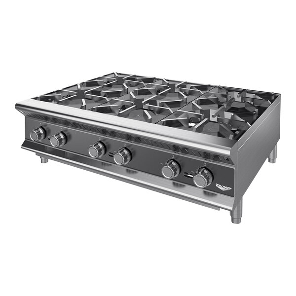 A stainless steel Vollrath countertop gas range with six burners.