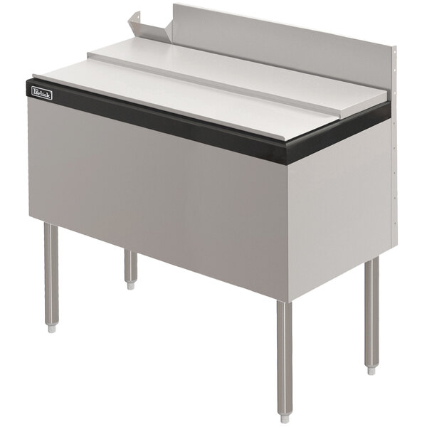A stainless steel Perlick underbar ice chest on a counter.