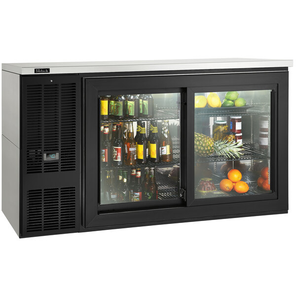 A Perlick black sliding door back bar refrigerator filled with drinks and bottles.