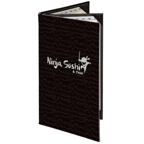 A black menu book with white text that reads "Menu Solutions" on the cover.