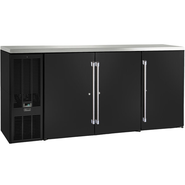 A black Perlick back bar refrigerator with silver handles on two narrow doors.