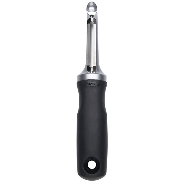An OXO Good Grips peeler with a black handle and silver blade.