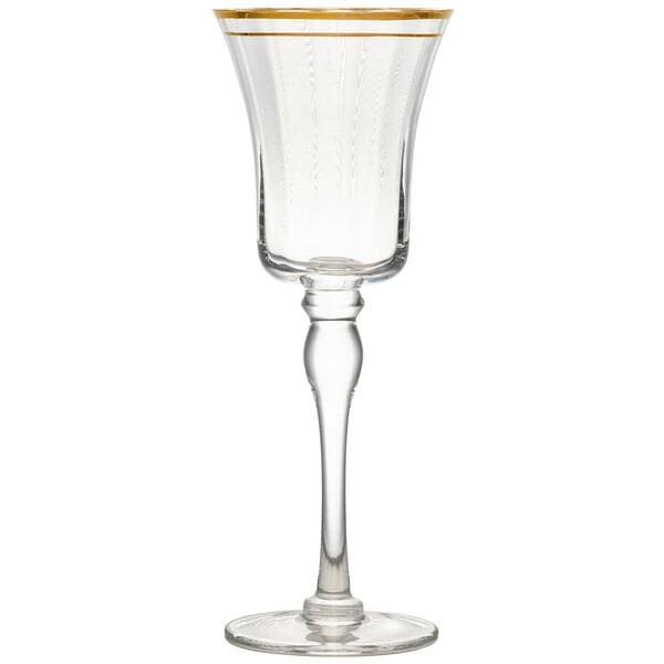 A clear wine glass with a gold rim.