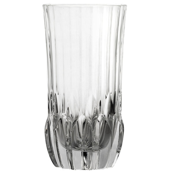 A close-up of a clear 10 Strawberry Street highball glass with a patterned design and curved edge.