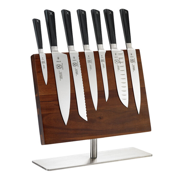A Mercer Culinary Z&#252;M 8-piece knife set on a wooden stand.