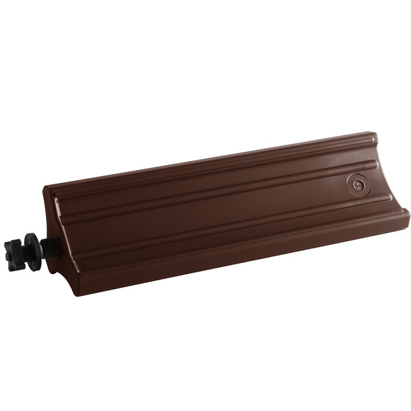 A brown rectangular object with a black handle.