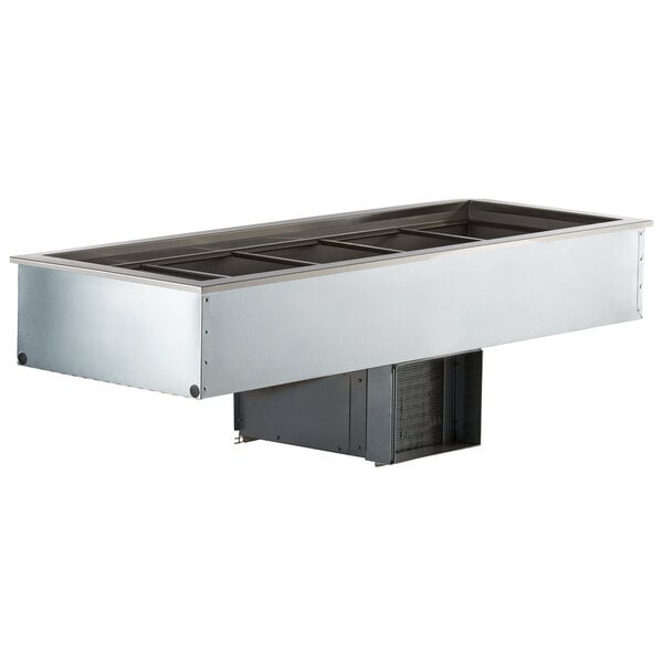 A Delfield drop-in refrigerated cold food well with five pans in a stainless steel counter.