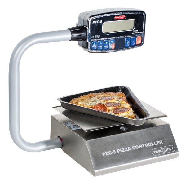 A pepperoni pizza in a pan on a Tor Rey digital pizza scale.