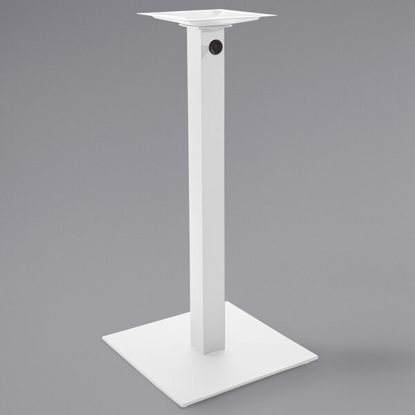 A white square table base with a pole.