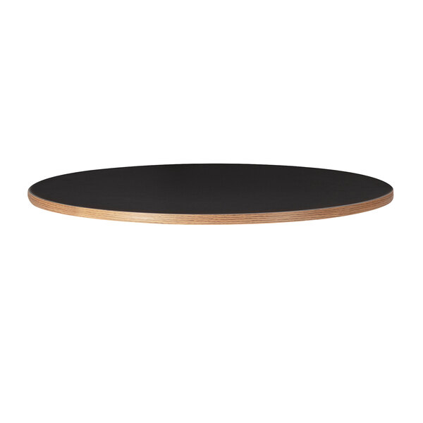 A black round Bon Chef table top with a wooden edge.