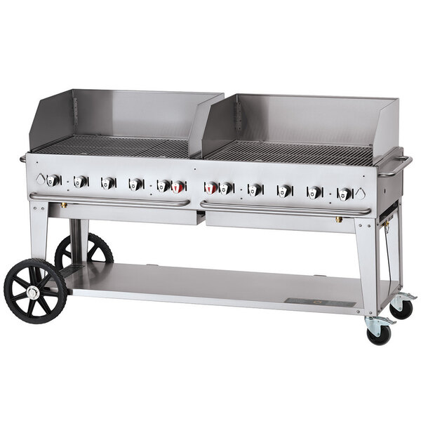 A large Crown Verity stainless steel mobile outdoor grill with wheels.