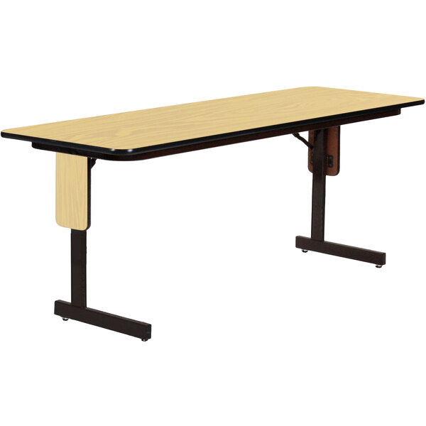 A rectangular Correll seminar table with black panel legs.