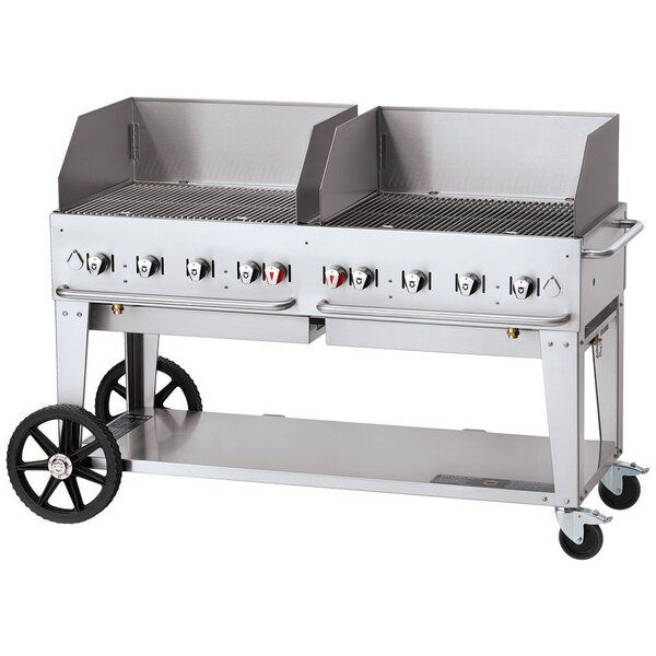 A large Crown Verity stainless steel mobile grill with a lid and wheels.