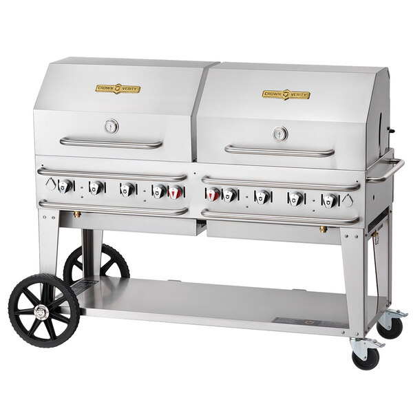 A silver Crown Verity portable outdoor grill with wheels.
