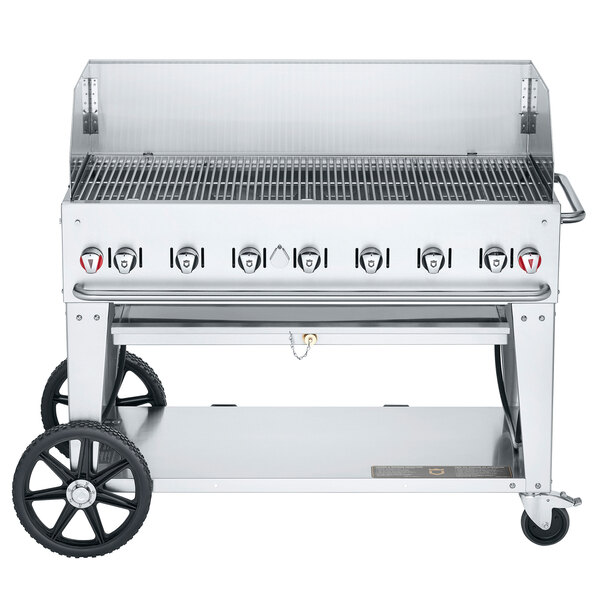 A Crown Verity stainless steel mobile outdoor grill with wheels and a lid.