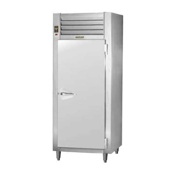 A Traulsen stainless steel pass-through refrigerator with a solid door.