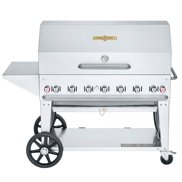 A silver stainless steel Crown Verity mobile outdoor grill with wheels.
